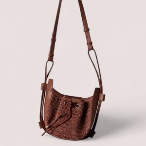 NWT FREE PEOPLE Cabana Woven Raffia & Leather Drawstring Closure Crossbody Bag